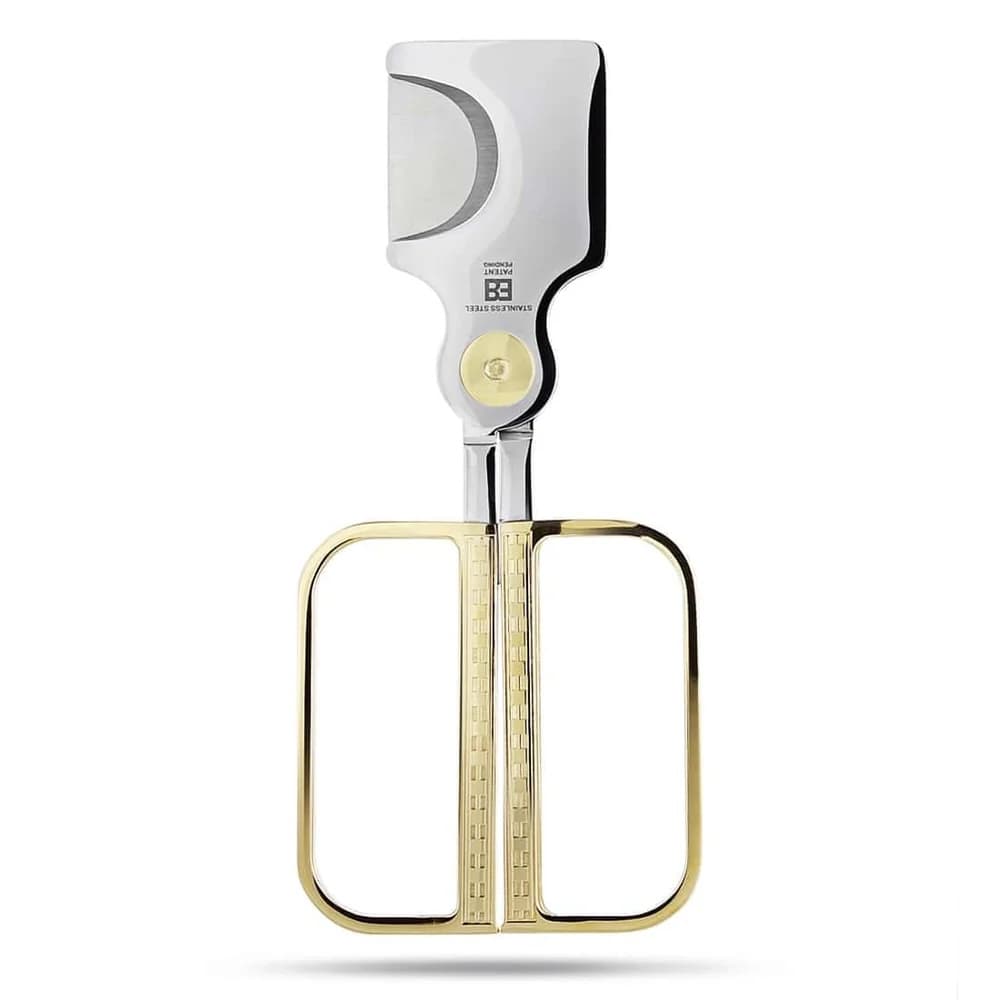 A gold-handled cigar cutter